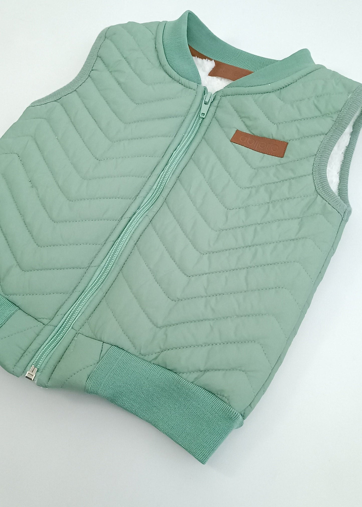 Chaleco impermeable con ovejero niño